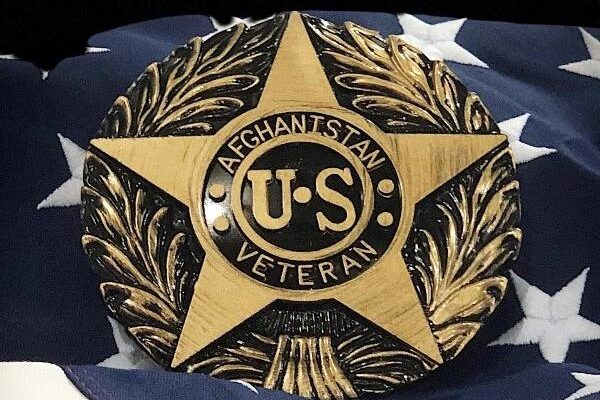 US Afghanistan veteran marker displayed on an American flag background