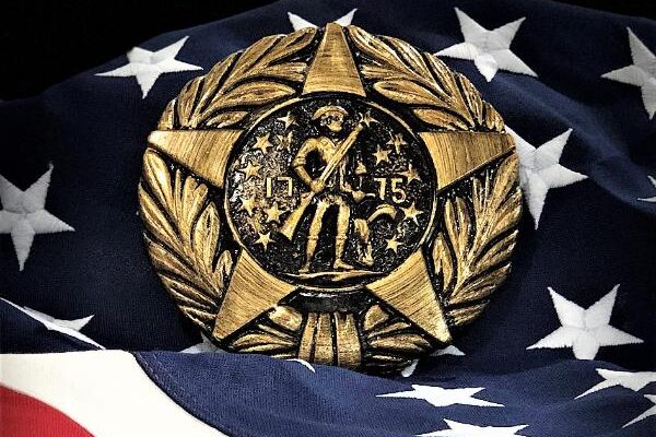 Revolutionary War marker displayed on an American flag background