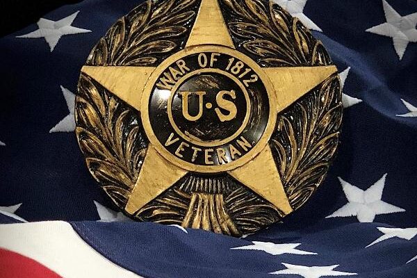 War of 1812 U.S. Veteran marker displayed on an American flag background