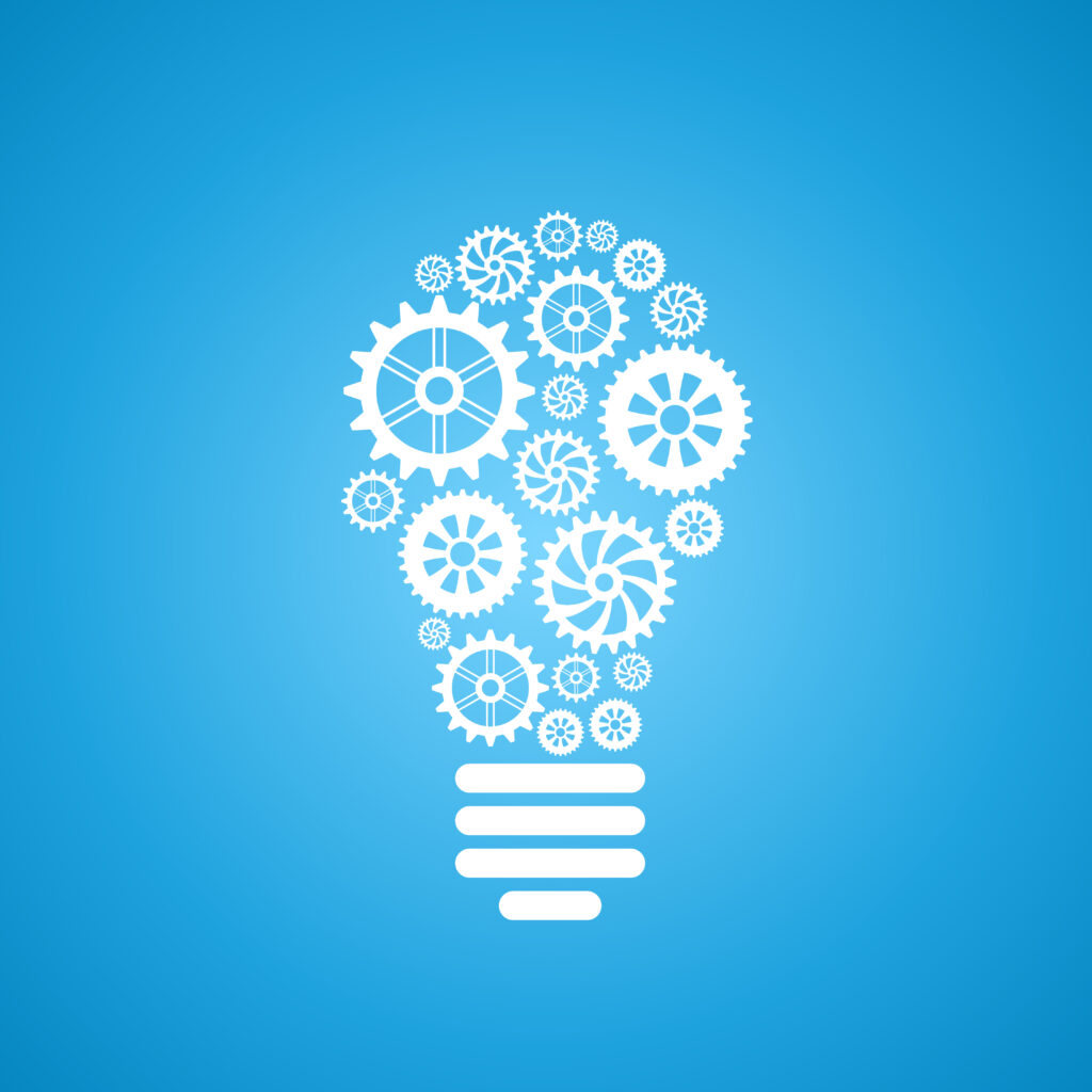 Illustration of a light bulb filled with gears and cogs, symbolizing innovation and creative thinking.